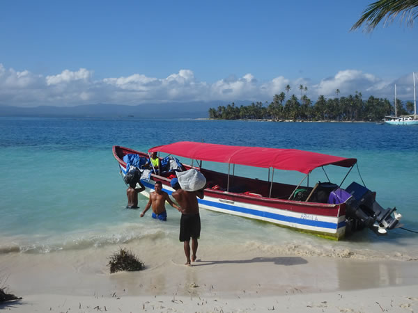 Kuna Indians loaded our gear back on the tour boat – in the morning after first night in San Blas Islands, Panama.