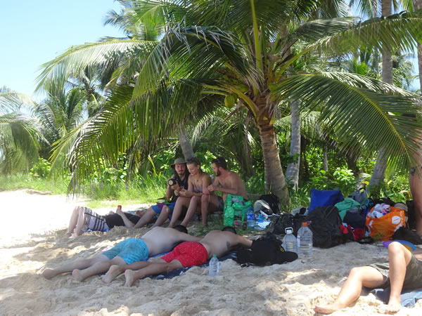 Part of travel team on uninhabited San Blas Island, Panama.