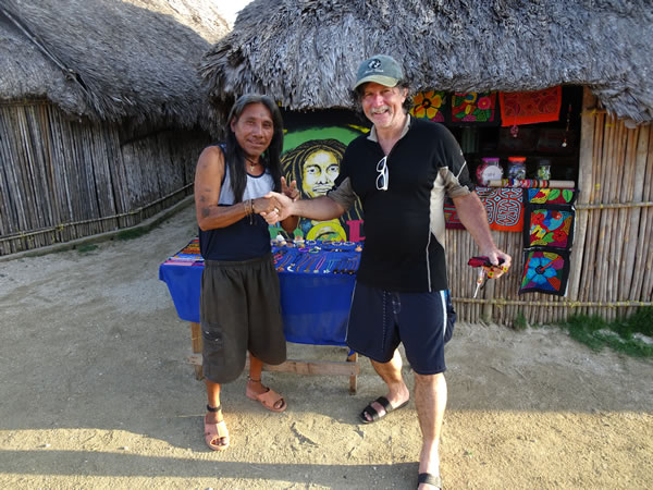 Ted with Kuna Indian on a San Blas Island. Ted bought a necklace with a Darien Gap jaguar claw from this man.