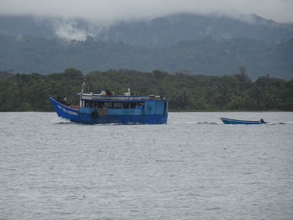 Boat with main land of the Darian Gap in the background, Panama.