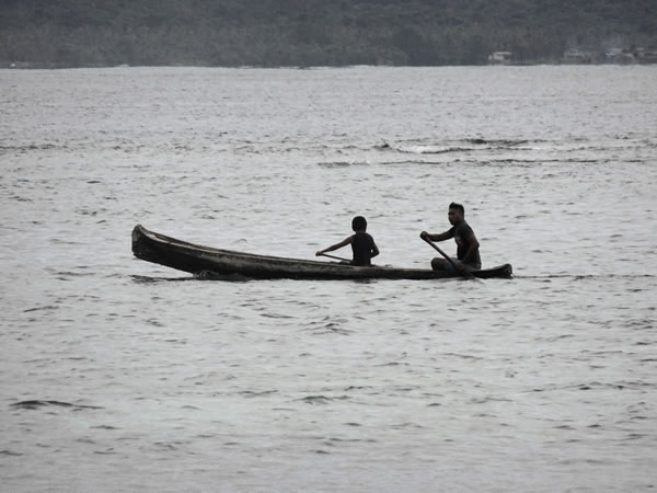 Canoe with Kuna Indians near San Blas Island, Panama.