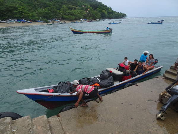 A boat with our gear arriving in Capurgana, Colombia.
