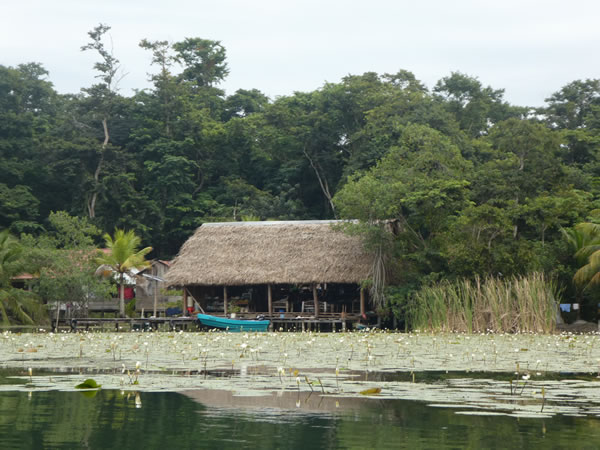 Home/store on the shore of the Rio Dulce between the town of Rio Dulce and Livingston, Guatemala.