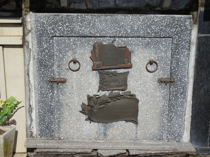 Grave with latched and handles for viewing at cemetery in Colonia, Uruguay