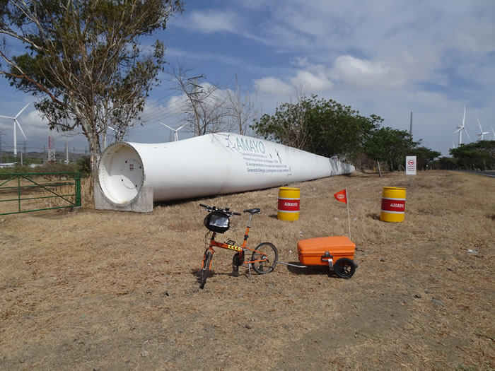 Ted’s bike near electrical wind turbine prop south of Rivas in Nicaragua.