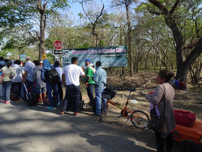 Ted’s bike in the middle of line at the border to go from Nicaragua to Costa Rica. – near welcome to Costa Rica sign.