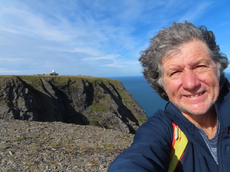 Ted on cliffs over Barents Sea near Nordkapp, Norway.