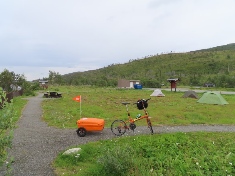 Teds bike and campers at a rest stop between Skaidi and Alta Norway.  You can camp anywhere that is not marked as private in Norway, Finland and Sweden.
