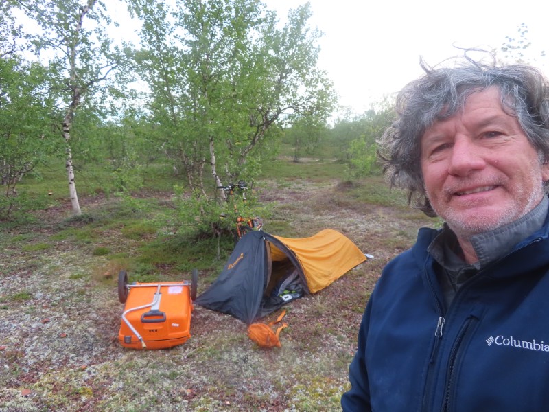Ted with his bike at his campsite 10 miles before Kautokeino, Norway.  It was a cold night, Ted did not have a warm sleeping bag,