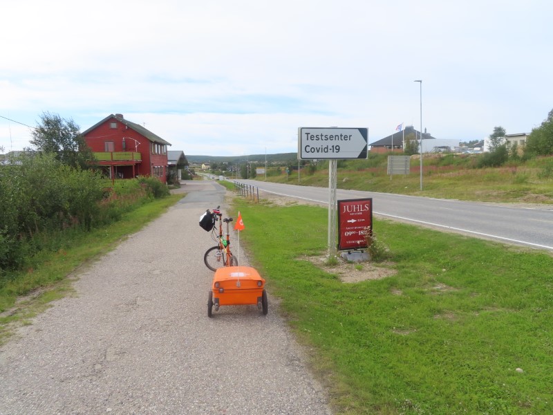 Teds bike near sign for a place to get a COVID test.  This was just north of the Finland boarder.  Ted believes he would have needed a COVID test earlier this year to enter Finland.  At the time of Teds trip there were no COVID restriction traveling between Norwegian countries.