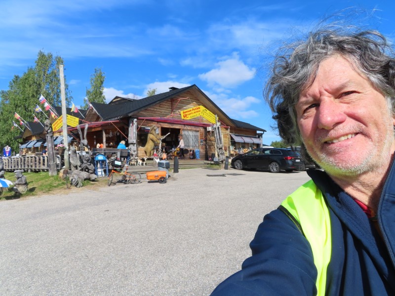 Ted in front of Sannan Putiikki gift store in Ktksuvanto, Finland.