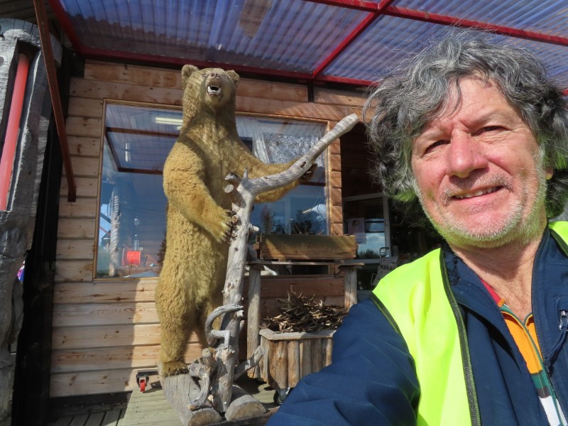 Ted in front of taxidermy bear at Sannan Putiikki gift store in Ktksuvanto, Finland.