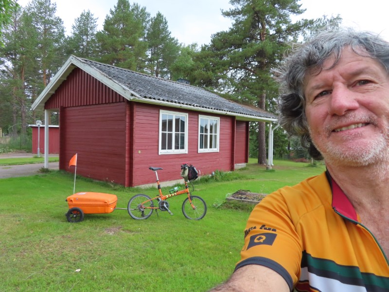 Ted with his bike at the cabin he stayed at in Pajala, Sweden.