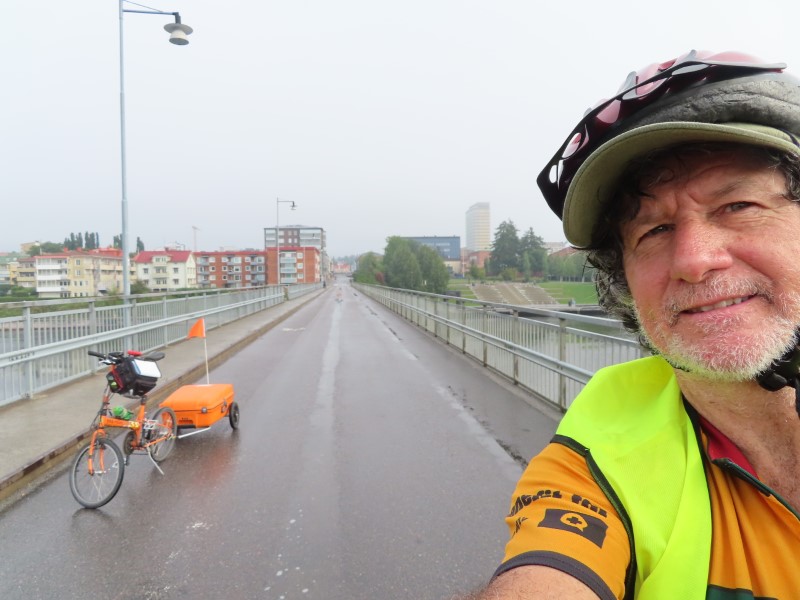 Ted with his bike on bridge used to exit city of Skellefte, Sweden.