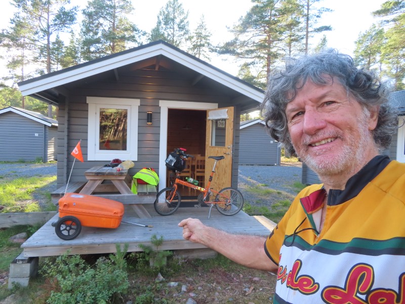 Ted with his bike at the cabin he stayed in at campground in Norrfällsviken, Sweden.