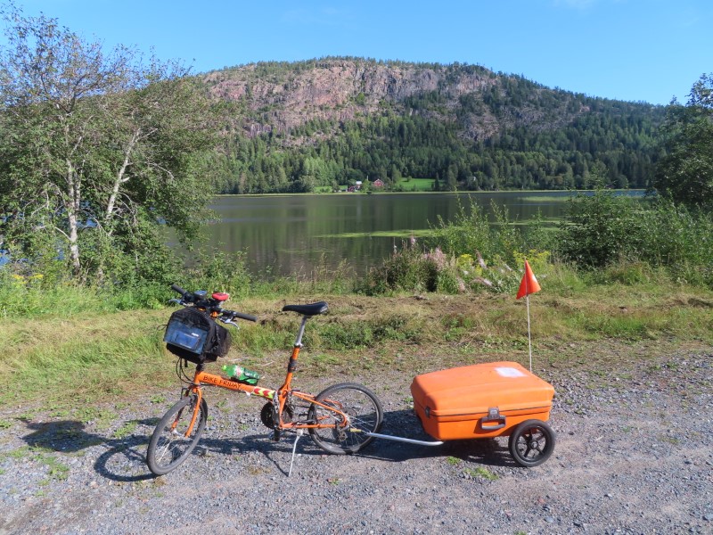 Teds bike with lake in Nordingr near Mjllom, Sweden.