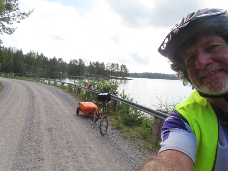 Ted and his bike near lake between Ullnger, Sweden and Bjrtr, Sweden.