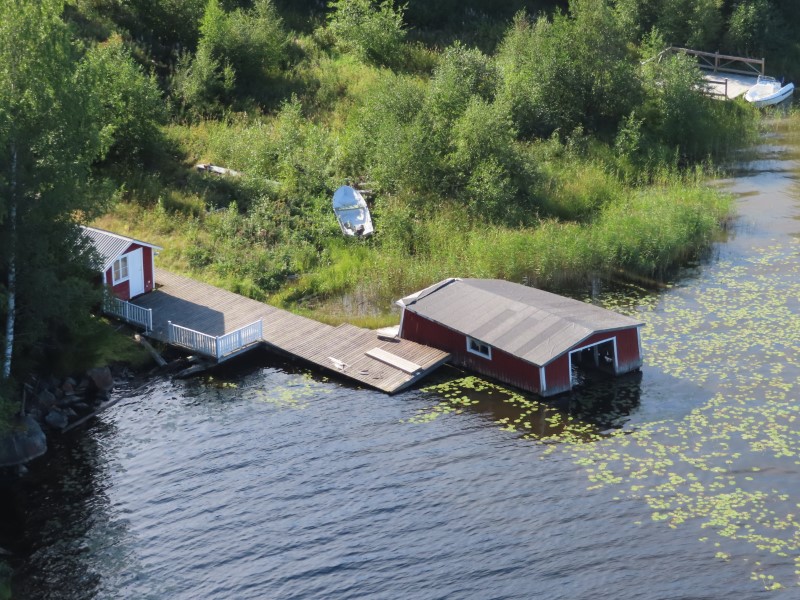 Sinking boathouse on ngerman River seen from the bridge to Lunde, Sweden.
