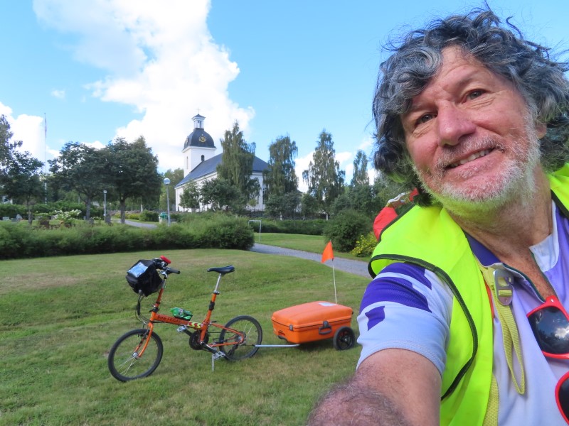 Ted with his bike and Church behind him near sng, Sweden.