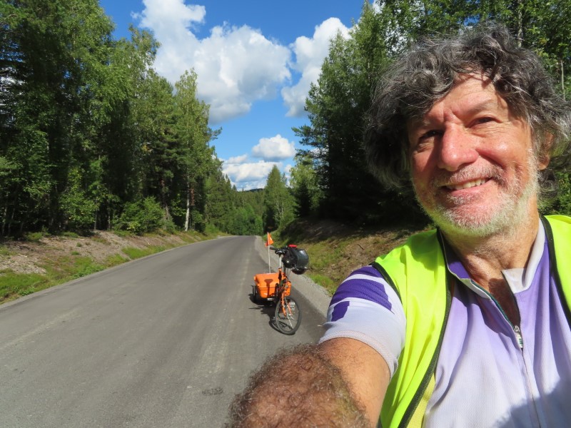 Ted with his bike on road between Stigsj, Sweden and sng, Sweden.