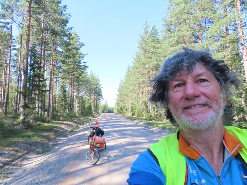 Ted with his bike on the road between Trollsved, Sweden and Bergsj, Sweden.