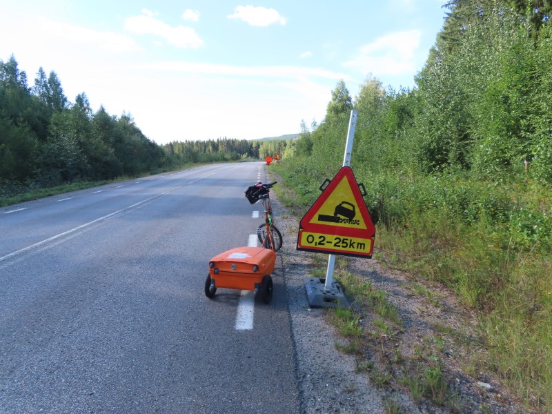 Teds bike with a road construction sign between Iggesund, Sweden and Kllene, Sweden. Ted was lucky the road had just been completed.  The next 25 KM where some of the best roads Ted had on this trip.  See the next couple of pictures.
