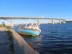 Sinking boat in water by E4 bridge on Baltic Sea inlet in Sundsvall, Sweden.
