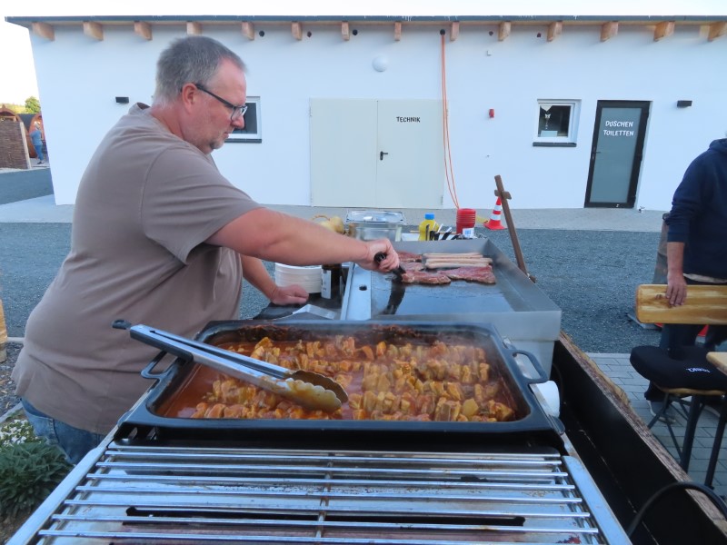 The camp manager BBQing dinner at the campground in Kirchenlamitz, Germany.