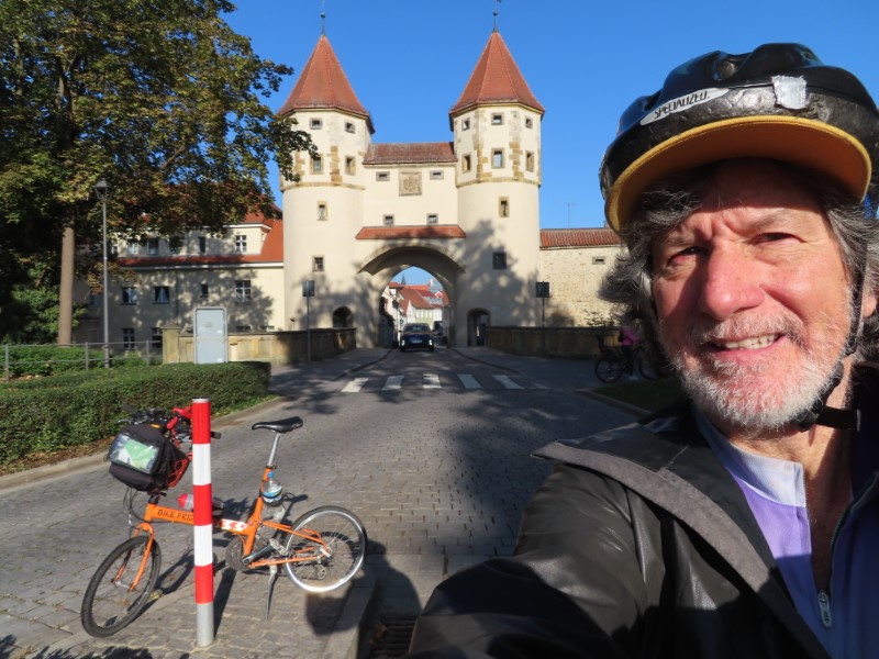 Ted with his bike in front of Nabburg Gate in Amberg, Germany.