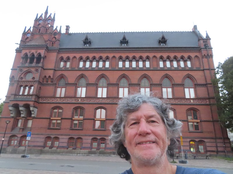 Ted in front of building in Rostock, Germany.