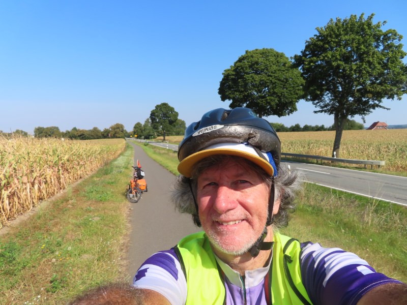Ted and his bike on trail next to corn field near Kuhs, Germany.