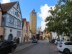 Castel gate clock and bell tower on Herrngasse street in Rothenburg ob der Tauber, Germany.