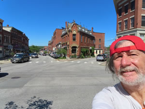 Ted with buildings in Belfast, Maine.