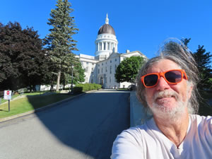 Ted with capital building in Augusta, Maine.
