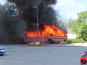 Bus fire by my rental car in Walmart parking lot in Chelmsford, Massachusetts.