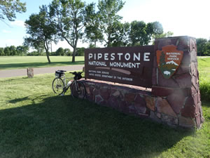 Ted’s bike at sign to Pipestone National Monument in Pipestone, Minnesota.