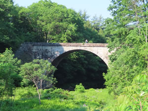 Stone Arch Bridge on Cheshire Rails Trail east of Keene, New Hampshire.