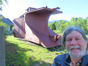 Ted in front of the 1951 Russell Snow Plow on display in Gorham, New Hampshire.