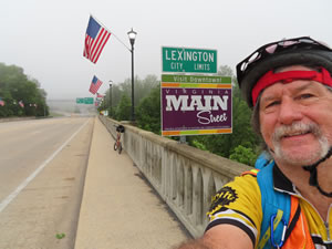Ted and his bike at the Lexington, Virginia city limit sign.