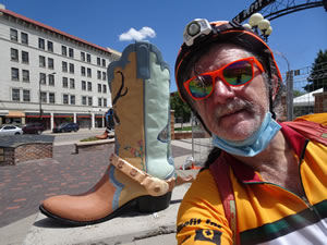 Ted with his bike and city boot theme behind him in Cheyenne, Wyoming.