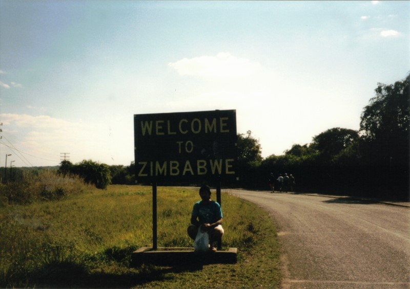 Ted in front of the Welcome to Zimbabwe sign near the Bungee Jumping Bridge between Zimbabwe and Zambia. (Near Victoria Falls)