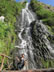 Lady at waterfall in Banos, Ecuado