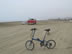 Ted’s bike with a VW truck in the background camping on the beach of Huanchaco, Peru. 