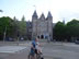 Amsterdam – Cyclist on cell phone with child