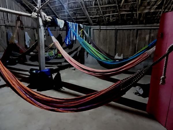Hammocks used for San Blas adventure sleeping arrangement in straw hut on third night on San Blas Island, Panama.