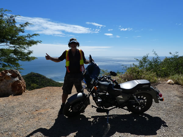 Ted with motorcycle in Mexico (The owner of the Motorcycle took this photo).