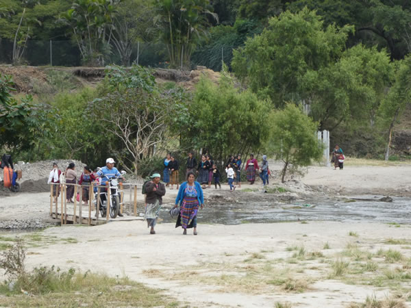 People crossing bridge to Panajachel, Guatemala.