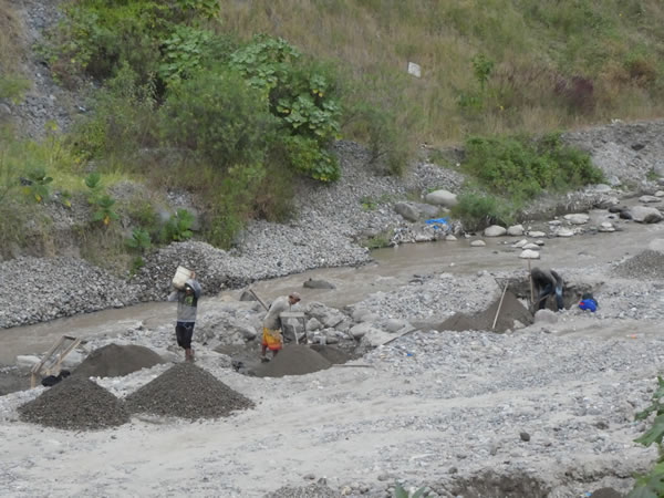 People sorting gravel (Common on rivers) near Panajachel, Guatemala.