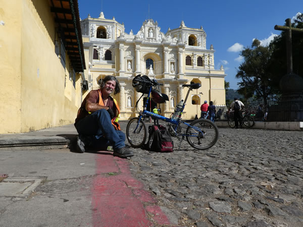 Ted with his bike in front of La Merced church in Antigua, Guatemala.