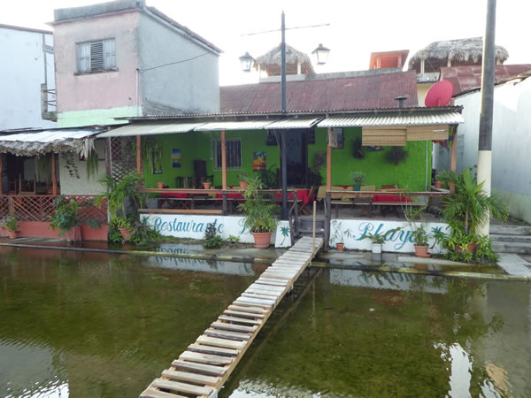 Flooded street in front of restaurant in Flores, Guatemala.